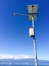 Low angle view of blue sea against clear sky