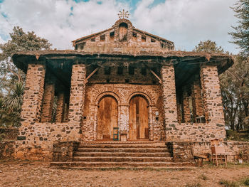 Low angle view of historic building against sky