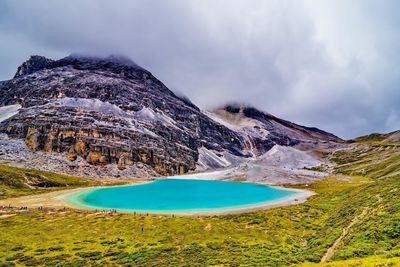 Scenic view of pearl lake against cloudy sky