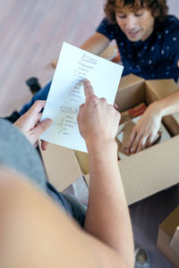 Close-up of woman holding hands on table