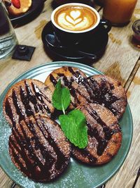 High angle view of coffee served on table