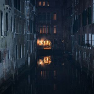 Buildings in city at night