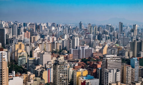 High angle view of buildings in city against sky