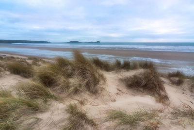 Scenic view of beach against sky