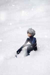 Boy in snow on land