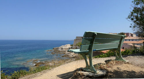 Scenic view of sea against clear blue sky