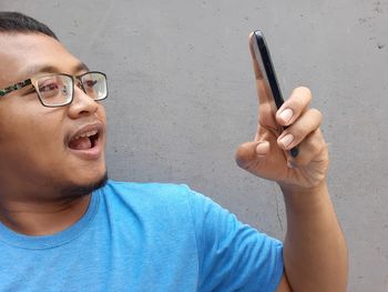 Portrait of mature man using mobile phone