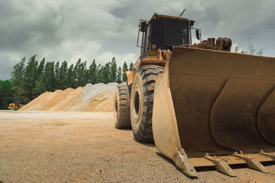 Panoramic view of agricultural field against sky