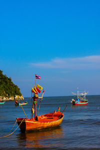Boats sailing in sea