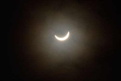 Low angle view of moon against sky at night