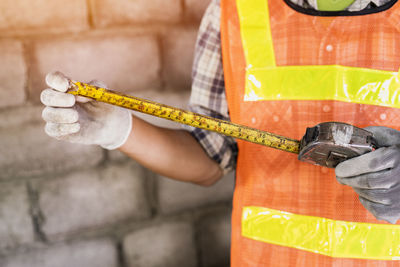 Close-up of man working on wood