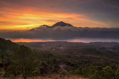 Scenic view of mountains against sky during sunset