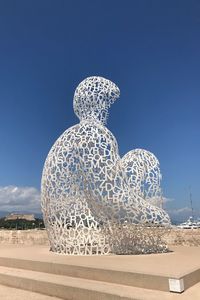 View of statue against clear blue sky