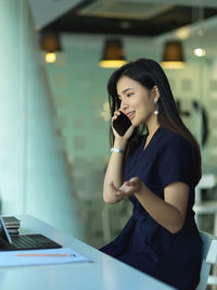 Young woman using smart phone