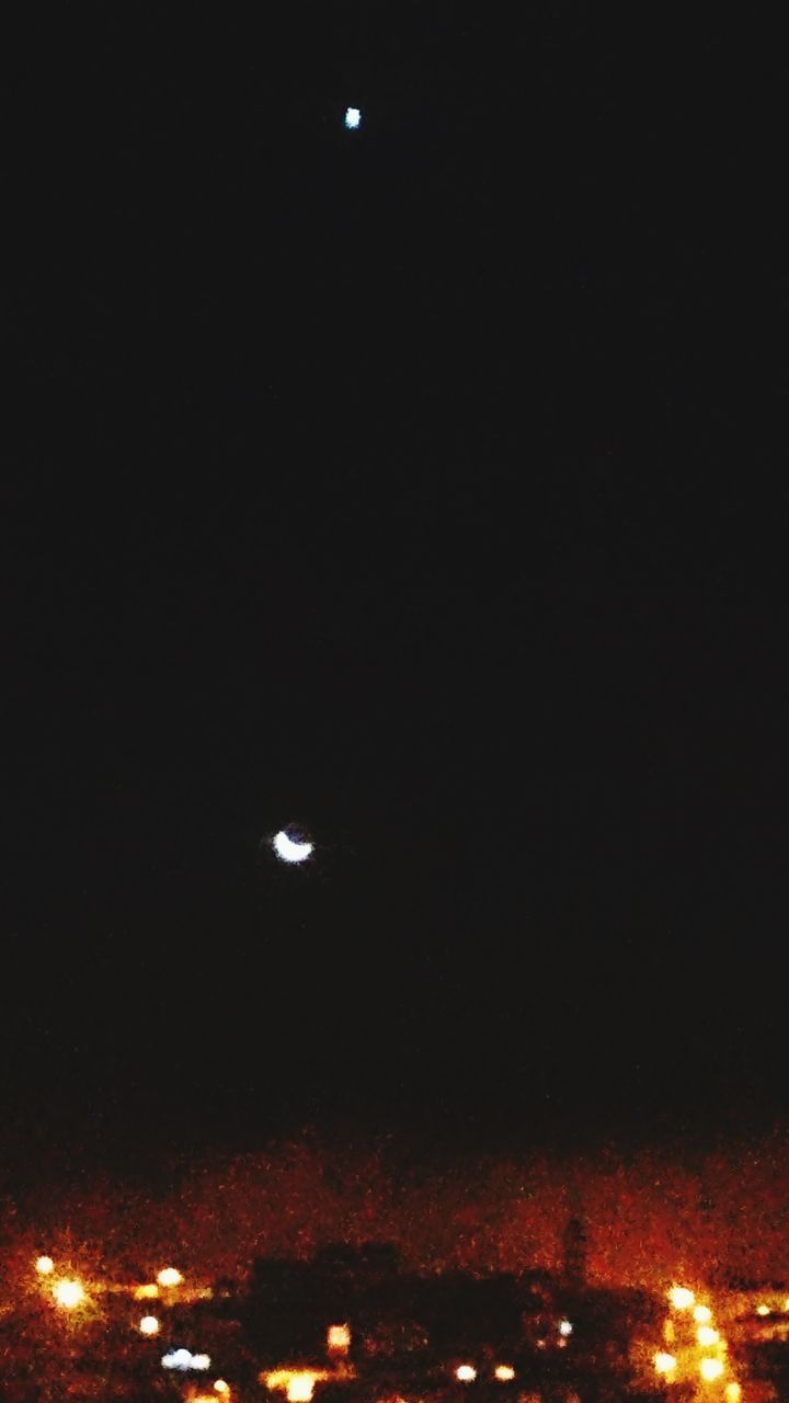 AERIAL VIEW OF ILLUMINATED MOON AT NIGHT