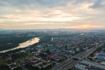 High angle view of city against sky during sunset