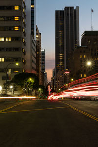 Los angeles at night with car trails leading down the streets