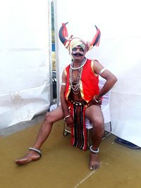 Full length of woman wearing mask