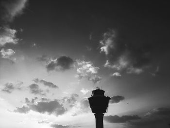 Low angle view of street light against cloudy sky