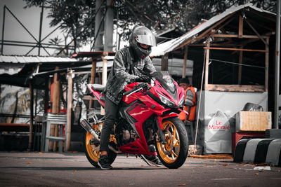 Man riding motorcycle on road