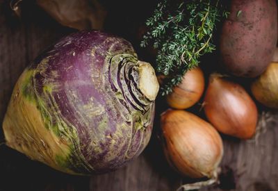 Rutabaga and onions on table