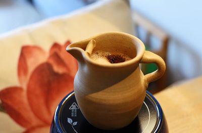 Close-up of coffee cup on table