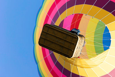 Low angle view of hot air balloon against blue sky