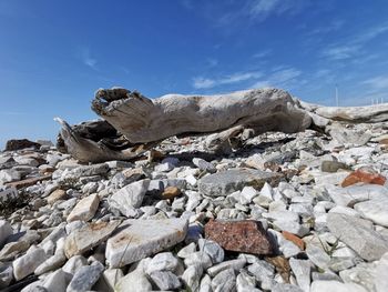 Low angle view of rocks against sky