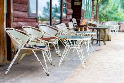 Empty chairs and tables in cafe