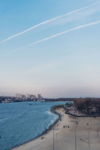 Scenic view of sea and buildings against sky