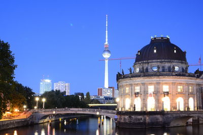 Illuminated buildings in city at night