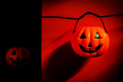 Close-up of pumpkin on red halloween