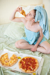 Midsection of woman eating food