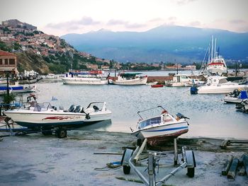 Boats moored at harbor