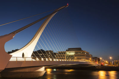 George bernard shaw bridge over river  liffey against dusk sky in dublin city