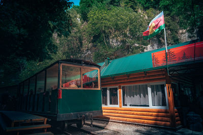 Low angle view of train against trees