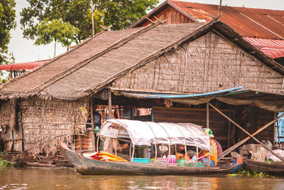 Boat in house by building