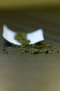 Close-up of paper on metal surface