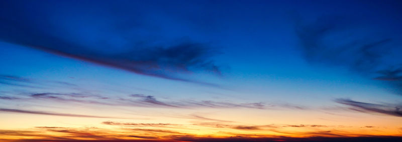 Low angle view of cloudy sky at sunset