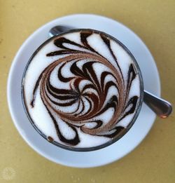 Close-up of coffee cup on table