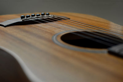 Close-up of guitar on table