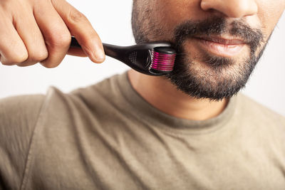Close-up portrait of man wearing sunglasses