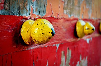 Close-up of doorknobs on old wooden door