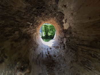 View of tunnel through hole in the wall