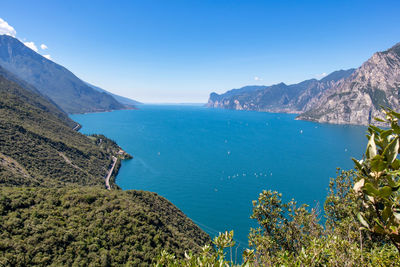 Scenic view of sea and mountains against sky