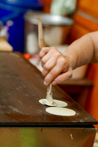 Close-up of person preparing food