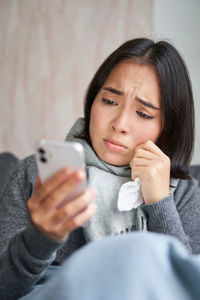 Young woman using mobile phone