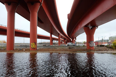 Below view of bridge over river against sky