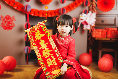 Full length of cute baby girl in traditional clothing