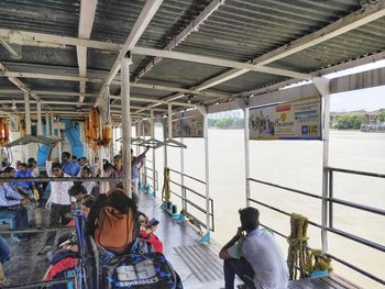 Rear view of people walking in bus